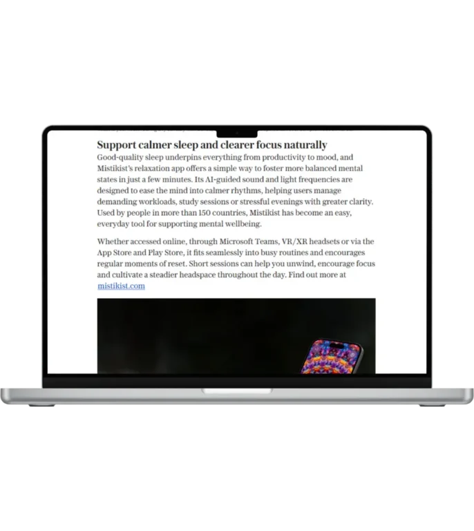 A notebook screen with an article on the Telegraph related to Mistikist app.